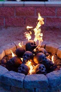 a fire pit filled with skulls and flames