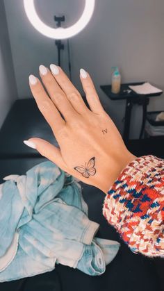 Butterfly hand tattoo Word Tattoos On Hand, Girly Hand Tattoos, Art Inspired Tattoos, Butterfly Hand Tattoo, Butterfly Tattoos For Women, Tattoos For Women Flowers, Healing Tattoo, Hand Tattoos For Women, Dope Tattoos For Women