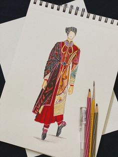 a drawing of a woman wearing a red dress and holding a black umbrella next to some colored pencils