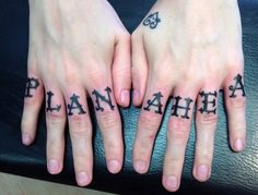 two hands with black lettering on them and one has the word plan ahead tattooed on it