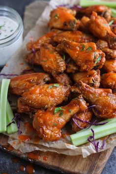 chicken wings with celery and carrots on a cutting board