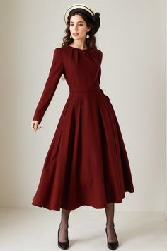 Burgundy long sleeve wool swing dress with a stylish folded neckline. This dress effortlessly blends elegance and comfort. The flared silhouette offers a graceful and flattering fit, while the high-quality wool fabric ensures warmth and softness. The folded neckline adds a touch of sophistication to this versatile dress, perfect for various occasions. DETAIL * 30% wool, 30% fiber, 40% polyester * fully satiny lining, more nice to the touch body * Round pleated neckline * Long sleeves * Fit and flare dress * Back zipper closure * Two side seam pockets * Below the knee length  * Lean More about the items From the FAQs on the page bottom MODEL SIZE Bust 85 cm(33.4")  Waist 67 cm(26.7")  Height 168cm (5' 6") She wears size XS Choose CUSTOM Order if you * Need a better fit * Can't find your siz Fall Dress Wedding Guest, Fall Dress Wedding, Nutcracker Outfit, Red Winter Dresses, Wool Dress Winter, Pleated Neckline, Fall Winter Dresses, Dress Wedding Guest, Dress Winter