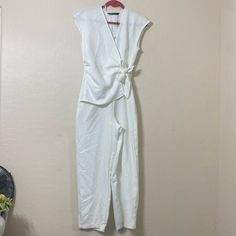 Zara Wide Leg Wrap Front With Side Tie And Rushing. V Neck Size Small Off White. Side Hidden Zipper Sleeveless Light And Comfortable. Nwt In Excellent Condition Approx Measurements Provided. White Summer Jumpsuits And Rompers For Work, White V-neck Jumpsuit With Tie Waist, Sleeveless Solid Color Pantsuit For Spring, Chic Sleeveless Jumpsuits And Rompers For Day, Elegant White Jumpsuits And Rompers For Day Out, Sleeveless Fitted Pantsuit By Zara, Zara Fitted Sleeveless Pantsuit, Sleeveless Fitted Zara Pantsuit, Chic White Jumpsuit With Tie Waist