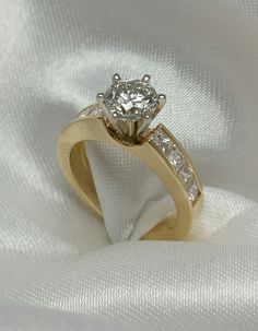 an engagement ring with two diamonds on it