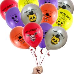 a bunch of balloons that say it's friday and have cartoon faces on them