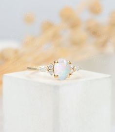 Rose gold:https://www.etsy.com/listing/815097030/vintage-white-opal-engagement-ringoval?ref=shop_home_active_29&pro=1&frs=1 White gold:https://www.etsy.com/listing/828997115/vintage-white-opal-engagement-ringoval?ref=shop_home_active_28&pro=1&frs=1 Alexandrite:https://www.etsy.com/listing/819979466/alexandrite-engagement-ring-oval-cut?ref=shop_home_active_15&pro=1&frs=1 Moonstone:https://www.etsy.com/listing/811751012/vintage-moonstone-engagement-ring-oval?ref=shop_home_a Elegant Opal Cluster Ring, Elegant Opal Cluster Wedding Ring, Elegant Opal Cluster Ring For Anniversary, Oval Opal Cluster Ring For Wedding, Elegant Marquise Opal Ring Gift, Elegant Marquise Opal Ring For Anniversary, Elegant Gift Opal Ring Marquise Shaped, White Opal Engagement Ring, Side Stone Ring