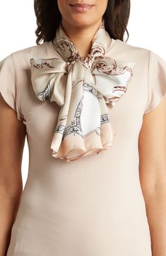 Luxuriously soft silk defines this elegant scarf, covered in a Victorian-inspired print. 68" x 20" 100% silk Dry clean Imported Luxury Cream Silk Scarf, Luxury Beige Scarf For Formal Occasions, Luxury Beige Formal Scarf, Silk Shawl For Spring Formal Events, Silk Shawl For Spring Formal Occasions, Silk Shawl For Formal Spring Events, Elegant Cream Scarf For Formal Occasions, Spring Formal Silk Shawl, Cream Silk Scarf For Formal Occasions