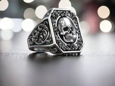 Royal Vintage Skull Rococo Signet Ring, Biker Ring, Punk Silver Ring, Gothic High Skull Ring, Oxidized Jewelry, Handmade Silver Ring For Men Elevate your style with our sophisticated silver rings for men. Crafted from high-quality materials, each piece is designed to stand the test of time while providing a touch of modern elegance to your look. Our collection includes a wide range of designs to suit any taste, from classic and simple bands to more intricate and unique styles. Whether you're dressing up for a formal occasion or looking to add a touch of polish to your everyday style, our silver rings for men are the perfect choice. Shop our collection now and find the perfect piece to express your individuality and enhance your wardrobe. ⭐ Check out our store for more unique design jewelry Skull Signet Ring, Signet Ring Vintage, Silver Rings For Men, Biker Ring, Silver Ring For Men, Handmade Silver Ring, Simple Band, Biker Rings, Vintage Skull