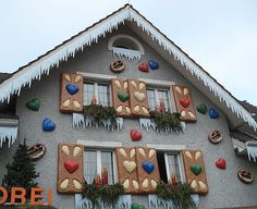 a house decorated for christmas with gingerbreads and hearts