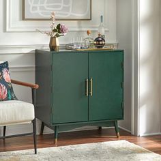 a green cabinet sitting next to a white chair