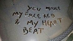 graffiti written on the side of a metal bowl that says, you make my face red and my heart beat