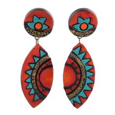 Inspired by Aztec motifs, Ritu Thapar proudly designs this pair of Indian dangle earrings, elaborated with floral and sun motifs in colors of red, orange, and turquoise blue. Local artisans craft the earrings by hand of ceramic, gracing the ears on sterling silver posts.