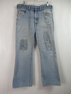 "Vintage 1970s faded denim pants, workwear. Lovingly patched and repaired over the years. Made by Sears Roebucks. Five pocket design. Zip fly. Actual measurements are: 35.5\" at the waist 29.5\" inseam 40\" overall length In good repaired and faded condition. There is an unprepared area over the left back pocket(photo)." Vintage Washed Cotton Jeans, Retro Ripped Cotton Jeans, Vintage Washed Denim Blue Pants, Vintage Washed Blue Flare Jeans With Pockets, Vintage Recycled Denim Blue Jeans, Ripped Vintage Jeans In Recycled Denim, Vintage Straight Leg Patchwork Bottoms, Vintage Ripped Jeans In Recycled Denim, Vintage Patchwork Straight Leg Bottoms