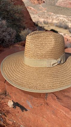 Our Palm Desert Panama fit in perfectly on our latest road trip photo shoot. Stunning, classic, chic - everything you've ever wanted in a hat. Featuring a molded crown with a pinched 10cm brim and hand woven straw, it's crystallized on the tone on tone ribbon with a simple Swarovski rivet. -Rancher style hat with a chill & casual vibe-Brim is flexible but holds its shape-Coordinating ribbon band-Pinched top-Great quality-- will last forever-This color actually goes with everything effortless Classic Woven Straw Hat For Kentucky Derby, Country Style Short Brim Straw Hat For Travel, Western Style Travel Hat For Spring, Country Style Straw Hat With Short Brim For Travel, Country Style Curved Brim Fedora For Travel, Country Style Curved Brim Hat For Travel, Classic Straw Boater Hat With Upf 50+, Classic Woven Straw Sun Hat, Kentucky Derby Travel Fedora With Upf 50+