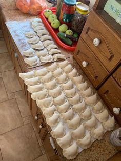 there are many dumplings on the counter ready to be made into appetizers