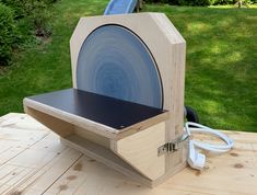 a wooden table with an electric device on it