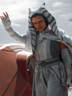 a star wars action figure is posed with his hands in the air