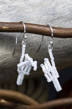 the white earrings are made from legos and have long silver earwires on them