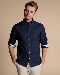 100% cotton, Available in classic, slim and extra slim fit, Natural stretch, Button-down collar, Rounded button cuff with two buttons, Classic and slim fit: back pleats, Extra slim fit: back darts, Machine washable - Button-Down Collar Stretch Washed Oxford Shirt - Navy Blue | Men's Charles Tyrwhitt Button-Down Collar Stretch Washed Oxford Casual Shirt - Navy Blue Single Cuff Size Large Cotton Classic Button-up Shirt With Back Button Closure, Classic Fitted Shirt With Back Button Closure, Navy Button-up Shirt For Semi-formal Occasions, Classic Navy Cotton Dress Shirt, Navy Fitted Shirt With Button Closure, Fitted Navy Shirt With Button Closure, Navy Classic Slim Fit Shirt, Classic Navy Slim Fit Shirt, Classic Navy Shirt With Button Closure