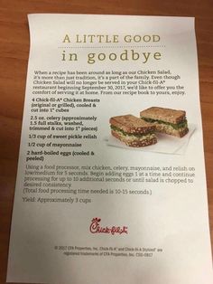 an advertisement for a sandwich made with chicken and lettuce is displayed on a table