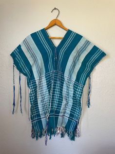 "Good Condition! Has flaws  measurements:  46\" bust, 27\" length" Traditional Summer Poncho For Festivals, Traditional Summer Beach Poncho, Blue Cotton Summer Poncho, Bohemian Cotton Tops One Size, Bohemian Short Sleeve Poncho For Spring, Short Sleeve Cotton Poncho For Summer, Cotton Short Sleeve Summer Poncho, Bohemian Short Sleeve Summer Poncho, Folk Style Tunic Tops For Beach