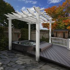 a hot tub sitting on top of a wooden deck