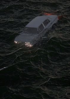 a car that is floating in the water