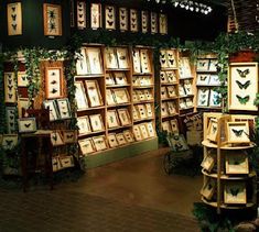 a room filled with lots of framed pictures