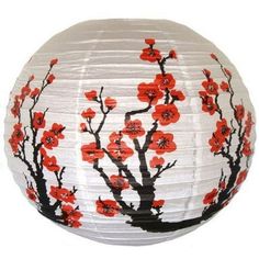 a white paper lantern with red flowers on it