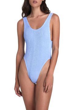 Made from super-resilient ribbed seersucker with a retro crinkled finish, this '80s-inspired one-piece features a low scooped back and cheeky coverage. Scoop neck Cheeky back coverage 95% nylon, 5% elastane Hand wash, dry flat Imported Ribbed One-piece Bodysuit For Poolside, Poolside Ribbed One-piece Bodysuit, Summer Sleeveless Ribbed Swimwear, One-piece Ribbed Swimwear For Poolside, Ribbed One-piece Swimwear For Poolside, Ribbed One-piece Swimwear For Pool, Fitted Textured Blue Swimwear, Blue Textured Fitted Swimwear, One-piece Ribbed Swimwear For Spring