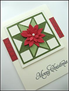 a christmas card with a poinsetti on it