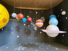 the solar system is hanging from the ceiling in this children's playroom area