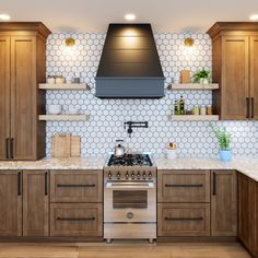 a stove top oven sitting inside of a kitchen next to wooden cabinets and counter tops