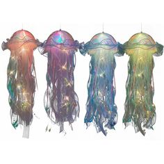 three jellyfishs hanging from strings with lights on them