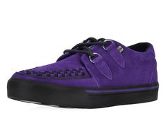 Normal is boring! Get ready to hit the stage or the streets in these vulcanized sneakers that reimagines our former creeper sneaker silhouette with bold & modern twists. Features one of our crowd-pleasing upper styles of purple cow suede with classic D-rings & iconic interlace detailing along the front. The VLK collection features a more streamlined and sleeker look compared to our past creeper sneaker designs. In addition to its' updated form, the vulcanized sneakers have removable insoles with a 3mm layer of memory foam and a lightly padded tongue for added comfort. VLK brings to you everyday wearability with a clean style while incorporating the edge & originality that T.U.K. is known for.