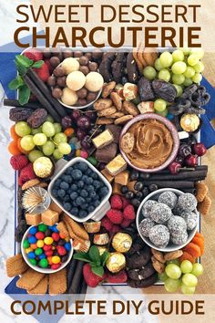 a tray filled with fruit and candy on top of a table