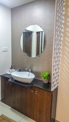 a bathroom with a sink and mirror in it