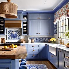 a kitchen with blue cabinets and wooden counter tops