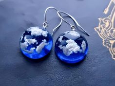 Handmade by myself. !You will get gift package with each order! This is a beautiful earrings with blue sky and white clouds, made with stainless steel hooks.  Dimensions: sphere diameter -0.79'' (2 cm)  earring length with hooks - 1.38'' (3.5 cm) REGULATIONS OF THE USE: *Resin jewelry must be kept separately from other jewelry (to avoid scratches)  *To restore gloss wipe with a soft cloth (velvet, flannel, glasses cleaning cloth) Air Witch, Fairy Nature, Earrings Cottagecore, Cottagecore Wedding, Strega Fashion, Sky With Clouds, Birthday Gift For Girlfriend, Gift For Mom Birthday, Terrarium Jewelry