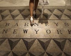 a woman in high heels is walking down the street