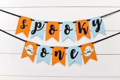 a banner that says spooky bone with skulls and bones hanging from the side