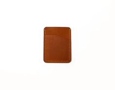 Handmade from high-quality genuine leather, this leather card case features a stylish and minimalist design that is suitable for all ages and styles. It is an ideal option for daily use with dimensions of 11x8cm, and can safely store your cards and cash. It has 2 card slots,  each of which can hold 2 cards as needed,  1 cash compartment. This card case is hand-stitched with waxed thread and has a unique appearance. The leather material used is carefully selected to ensure its quality and durability. As a natural material, leather develops a beautiful patina over time and has its own unique character. Customer satisfaction is important to us. If you have any questions or special requests, you can always reach us. This stylish leather card holder can be a great gift option for yourself or yo Brown Leather Patch Card Holder For Everyday, Everyday Brown Leather Patch Card Holder, Brown Minimalist Trifold Wallet, Minimalist Brown Rectangular Trifold Wallet, Brown Leather Patch Rectangular Card Holder, Rectangular Leather Patch Card Holder For Daily Use, Rectangular Leather Patch Card Holder, Minimalist Brown Rectangular Card Holder, Minimalist Brown Card Holder With Coin Pocket