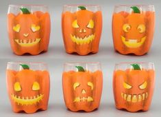 six pumpkin glasses with carved faces on them