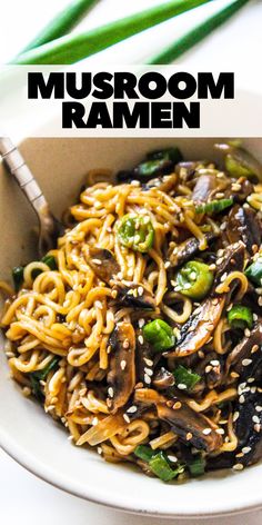 a bowl filled with noodles and mushrooms on top of a white table next to chopsticks