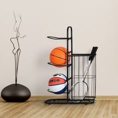 there is a rack with basketballs and other sports items in it on the floor