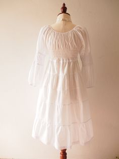 "This pure white cotton dress is unique design. You can have many look from this dress by matching this dress with many kind of hat, jewelry, shoes. It can be a hippie, boho, victorian and beach look all in one. The dress has long length 38\" from shoulder. The dress is handmade with high quality cotton material. The skirt is lined. This dress is special to own one to wear to many special occasion. MATERIAL Cotton Fabric Polyester lining material. SIZE ✴FREE SIZE✴ US0-US10 Bust: 30\"-36\" Waist: White Cotton Regency Prairie Dress, White Cotton Regency Style Prairie Dress, White Cotton Prairie Dress For Wedding, White Bohemian Dress For Gatherings, White Bohemian Cotton Peasant Dress, White Cotton Prairie Dress With Ruffles, White Pastoral Prairie Dress For Summer, White Cotton Peasant Prairie Dress, White Peasant Prairie Dress For Spring