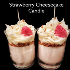 two desserts with strawberries and whipped cream in them on a black background text reads strawberry cheesecake candle