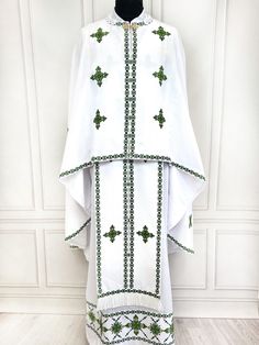 Elevate your church service attire with our exquisitely crafted Orthodox priest garments, adorned with rich green embroidery. This elegant set is designed with the utmost attention to detail, perfect for clergy who seek a traditional yet refined look. Made from premium fabrics, these church robes offer both comfort and durability, ensuring they last through many services. Ideal for priests, pastors, and clergy members, this vestment reflects the deep spiritual significance of religious garments. The set include: - phelonion - epitrachelion - cuffs - belt - covers (3 pieces) - sticharion Size: 131 cm / 51.5 inch length of the main product Length according to the client's needs (+ to the cost by agreement) A complete set of Orthodox clerical vestments carefully crafted to meet the ceremonial Luxury Traditional Wedding Vestments, Priestly Garments, Orthodox Priest, Church Attire, Church Service, Greek Style, Elegant Sets, Greek Orthodox, Hand Embroidery