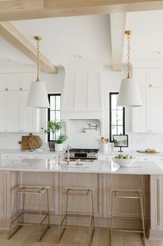 the instagram page shows an image of a kitchen with white cabinets and counter tops