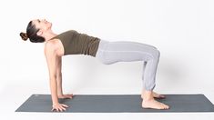 a woman is doing a yoga pose on a mat in front of a white background